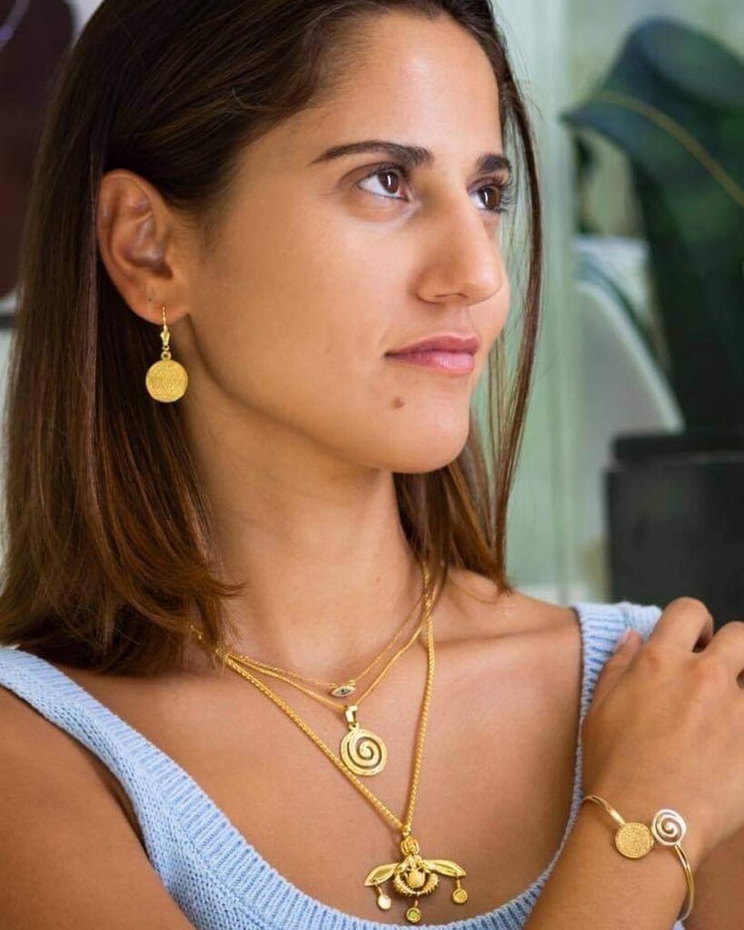 A woman wearing handcrafted jewelries
